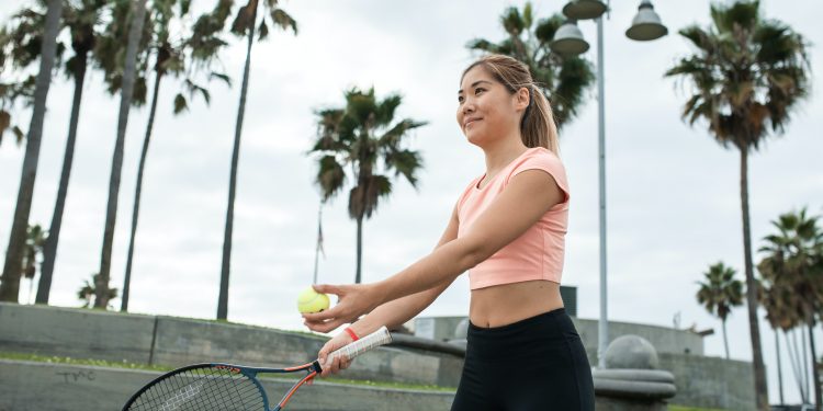 Girl plays tennis